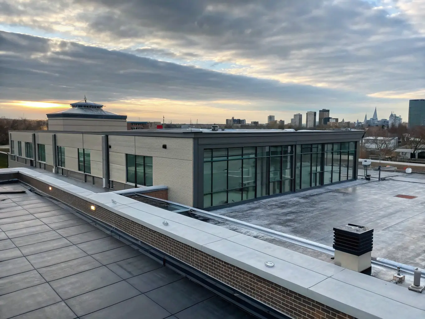 A commercial building with a newly installed flat roof by TJB Construction, highlighting durability and professional installation.