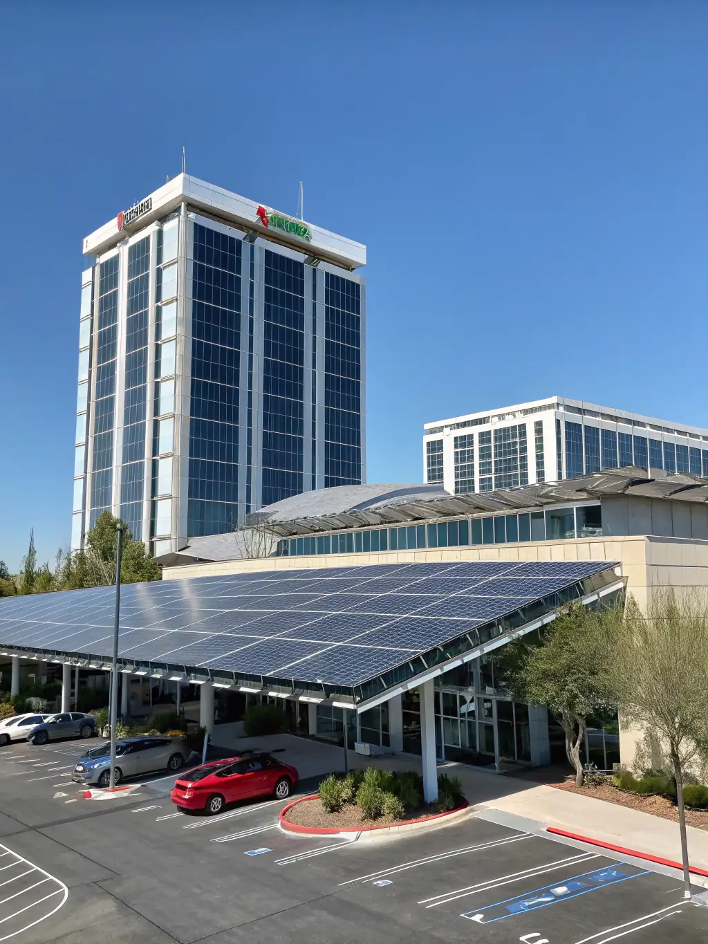 A drone shot of a completed commercial roofing project by TJB Construction, featuring a flat roof with energy-efficient coating, solar panels, and proper drainage systems, set against a clear blue sky.