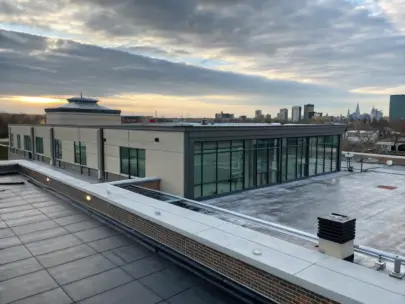A commercial building with a newly installed flat roof, showcasing professional craftsmanship and weatherproofing by TJB Construction.